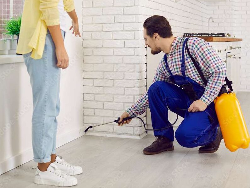 Exterminator and woman